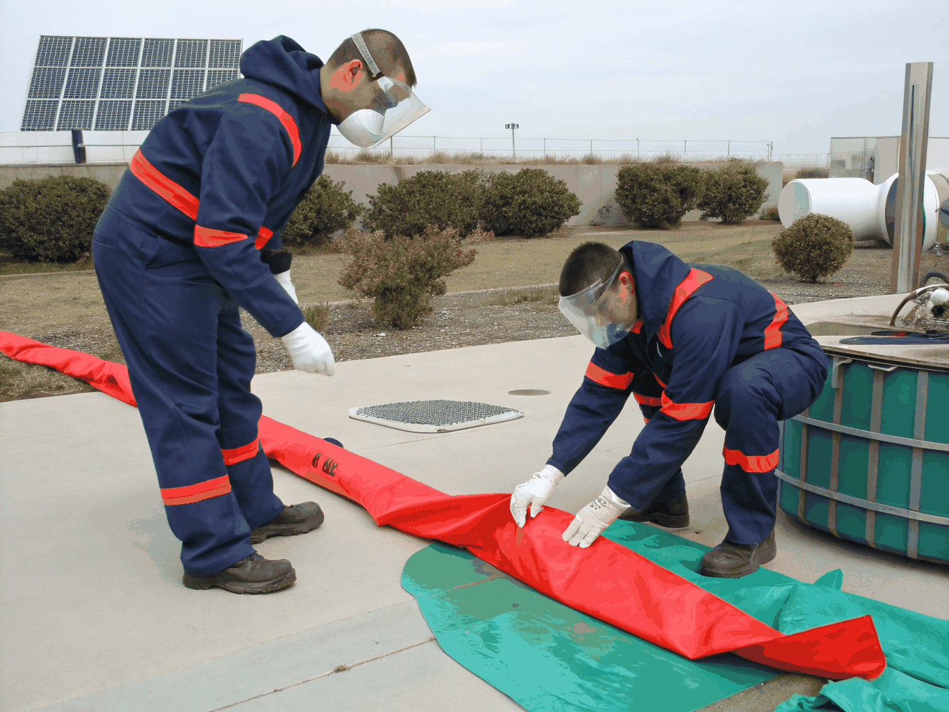 HazMat technician performing on-site chemical identification with handheld analytical device